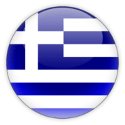 A round, glossy icon featuring the national flag of Greece with its characteristic blue and white stripes and a white cross in the upper left corner, depicted on a sphere.