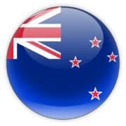 Icon featuring a spherical representation of the New Zealand flag. The sphere has a glossy surface with the flag design depicted on it, showing the dark blue background, the Union Jack in the top left corner, and the four red stars with white outlines to the right, which represent the Southern Cross constellation. The icon has a three-dimensional effect and a slight reflection at the bottom, giving it a polished, glass-like appearance.