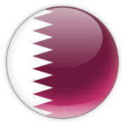 A circular icon with the flag of Qatar, a maroon field with a white serrated band on the left.
