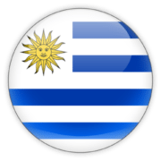 A circular icon featuring the flag of Uruguay with blue and white stripes and a yellow sun.
